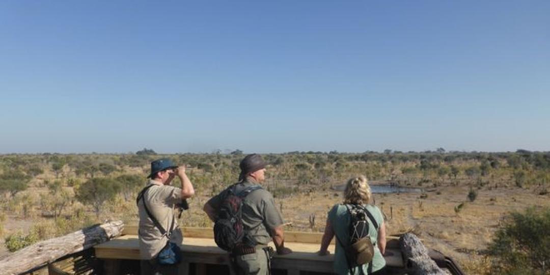 The platform overlooks the waterhole with wildlife such as buffalo, kudu and elephant nearby.