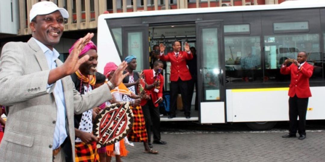 Kenya Airways CEO, Dr Titus Naikuni, joins traditional dancers to welcome guests on board its new shuttle bus.