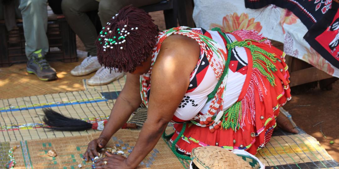 Village sangoma throwing the bones for visitors.