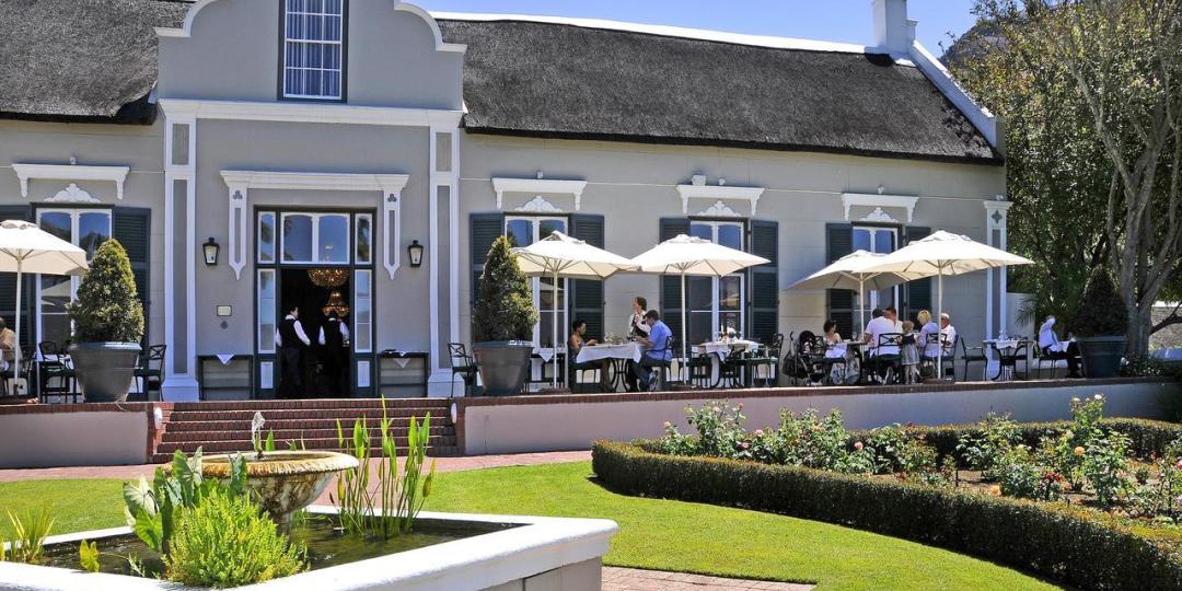 Diners enjoying a meal outside the Grande Roche Hotel.