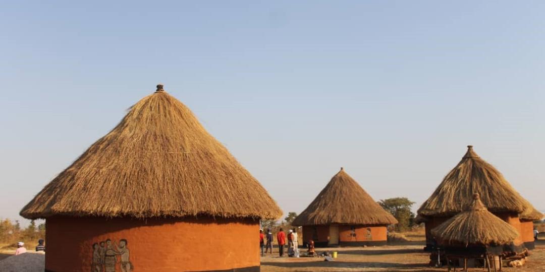 Part of the cultural village showing traditionally decorated huts.