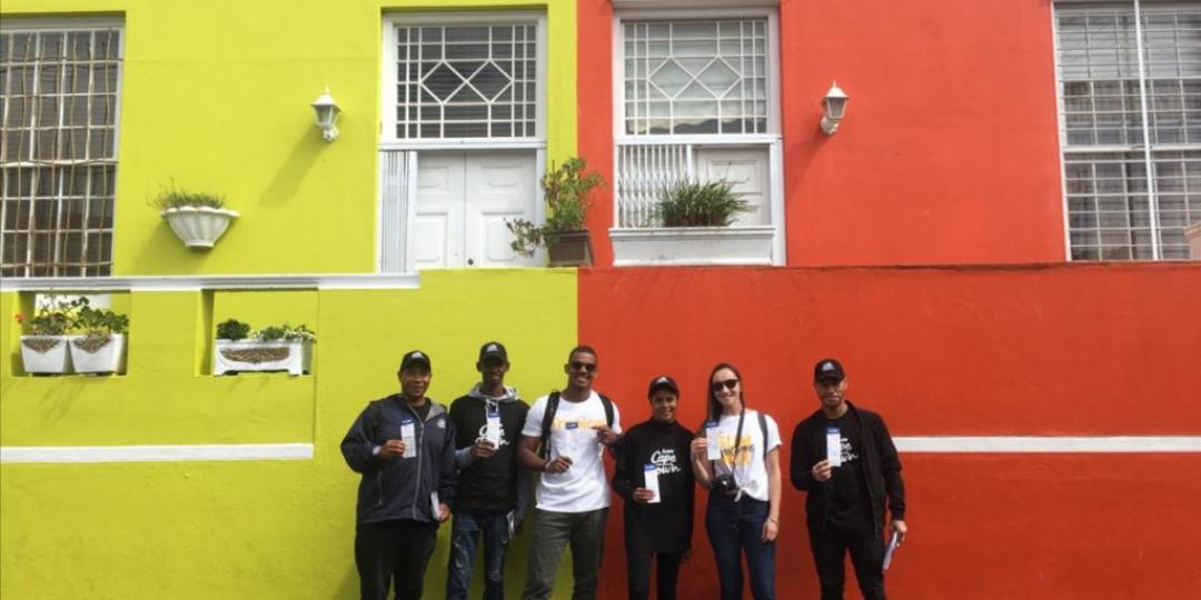 Tourists posing with Travel Wise ambassadors in their ‘Love Cape Town’ branded shirts.