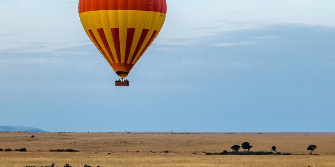 Hot-air balloon floating over the Maasai Mara
