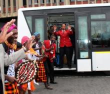 Kenya Airways CEO, Dr Titus Naikuni, joins traditional dancers to welcome guests on board its new shuttle bus.