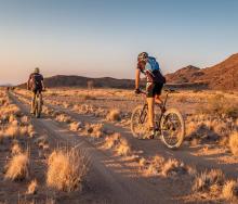 Visitors to Sossus Under Canvas can see some of Namibia’s best sights by bike. 