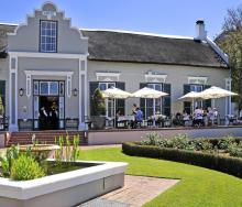 Diners enjoying a meal outside the Grande Roche Hotel.