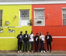 Tourists posing with Travel Wise ambassadors in their ‘Love Cape Town’ branded shirts.