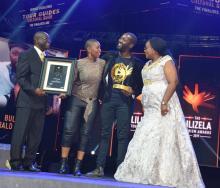 Bulelani Futshane accepting the Lilizela Award for Best Culture Guide of 2019